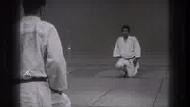 Tokyo Japan (1971): Chinese Men Make A Bow Before Kneeling With Calm Hands Lying