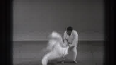 Tokyo Japan (1971): One Karate Man Flips Another Over On To The Mat