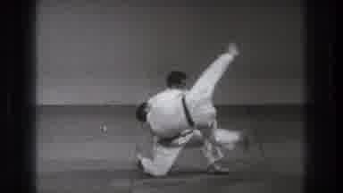 Tokyo Japan (1971): A Martial Artist Kneeling On One Knee Throws Another Onto A
