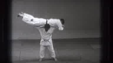 Tokyo Japan (1971): A Martial Artist Holds Another On His Shoulders And Then