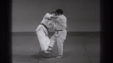 Tokyo Japan (1971): Two Men Dressed In Judo Uniform One Man Is Performing A Trip