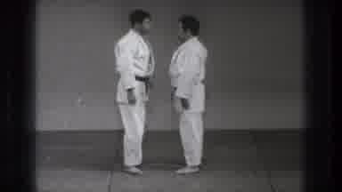 Tokyo Japan (1971): Two People Are Slowly Dancing With Karate Dress In Center