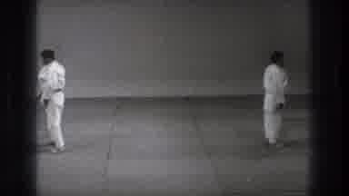 Tokyo Japan (1971): Two Men In Karate Clothes Facing Opposite Directions