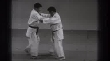 Tokyo Japan (1971): Two Martial Artists Practice A Body Throw On A Mat Covering An
