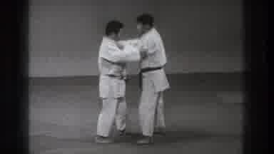 Tokyo Japan (1971): Two Asian Guys Showing How Is To Fight Karate Over Mat