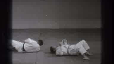 Tokyo Japan (1971): Two Men Wearing Martial Arts Clothing Stand Up And Face Each