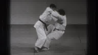 Tokyo Japan (1971): Person Wearing White Karate Uniform Flips Person Onto Grey