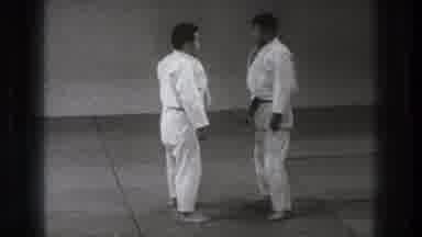 Tokyo Japan (1971): Two Men Wearing White Karate Uniforms Practice Arm Hold Move
