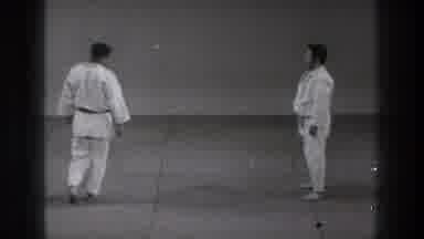 Tokyo Japan (1971): Two Men Wearing White Karate Uniforms Demonstrate Karate Move