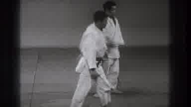 Tokyo Japan (1971): One Martial Artists Stands Up And Walks Over To Stand In Front