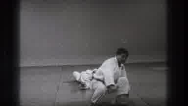 Tokyo Japan (1971): Men Wearing White Karate Uniforms Practice Arm Maneuver