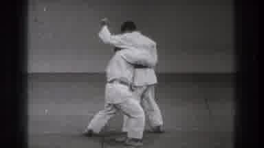 Tokyo Japan (1971): A Martial Artist Simulates Holding A Knife While Another