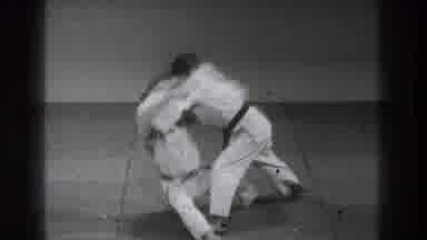 Tokyo Japan (1971): Slow-Motion Martial Arts Combat Between Two Men In Black And