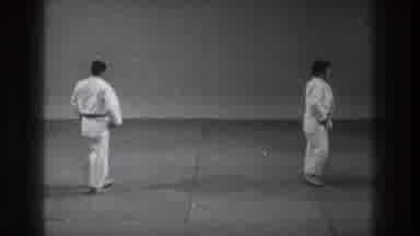 Tokyo Japan (1971): Two Men Wearing White Karate Uniforms Stand With Backs Facing