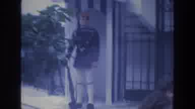 ATHENS GREECE-1976: Soldier Standing Guard At Gate In 8mm Film