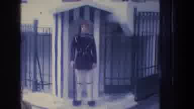 ATHENS GREECE-1976: Two Uniformed Guards Stationed At The Entrance Of A Gate