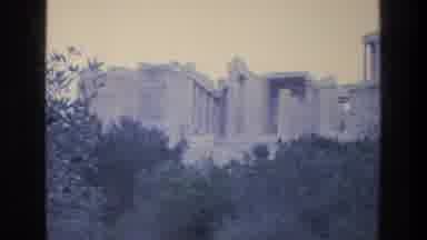 ATHENS GREECE-1976: Old Ruins Of Classical Greek Buildings On A Hill Above Trees