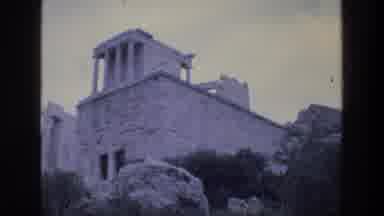ATHENS GREECE-1976: Tourists Gathered At Ancient Ruins For Guided Tour