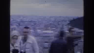ATHENS GREECE-1976: Tourists at Ancient Ruins Overlooking the City