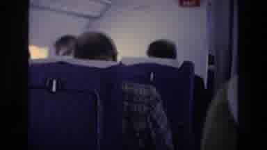 ATHENS GREECE-1976: An Aeroplane Flying Over Ice-Covered Mountains With Passengers Inside