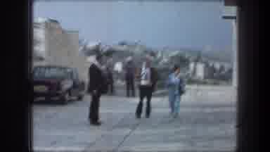Bethlehem Israel (1976): Three People Walking Down White Stone Pathway On A Clear