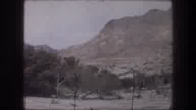 Bethlehem Israel (1976): View Of Tan Mountains And Trees On A Clear Day