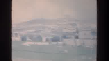 Israel a (1976): Rapidly Panning View Of A Vast Green Field And A House With Lots