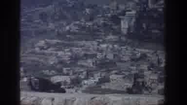 Jerusalem Israel-1976: White Camel Lazily Lying Staring Blankly At Old Poor Town