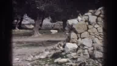 Jerusalem Israel (1976): Kneeling Man Photographs Distant Sheep