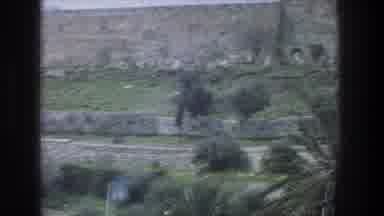 Jerusalem Israel (1976): An Old Movie Scene With Trees And And A Wall In The