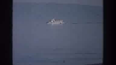 Sea of Galilee Israel (1976): Ship In Ocean With Land Visible In Background Pan To