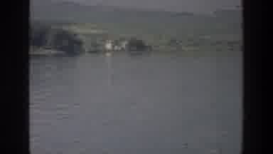 Sea of Galilee Israel (1976): Boat Sails Through Lake Near Rocky Islet Covered