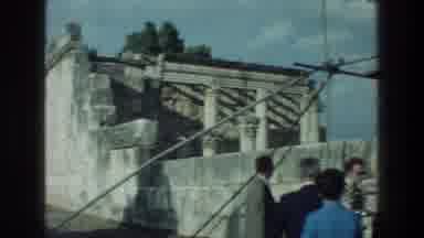 Sea of Galilee Israel (1976): Woman Wearing Green Dress Stands Next To Stone Wall