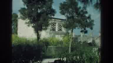 Sea of Galilee Israel (1976): A White Hut In The Middle Of Two Trees In The Forest
