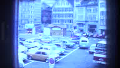 ZURICH SWITZERLAND-1976: Pink Text Then Window View Of Parked Cars In City