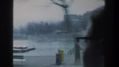 ZURICH SWITZERLAND-1976: Person Wearing Glasses Looks At Passing Lake View