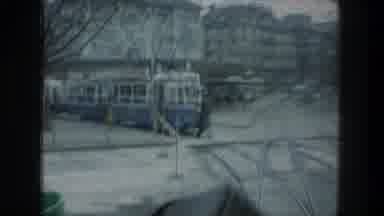 ZURICH SWITZERLAND-1976: Person Crossing Street Filmed From Moving Vehicle In