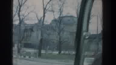 ZURICH SWITZERLAND-1976: Driving Through A Leafless Street Past A Trade Building