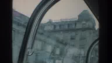ZURICH SWITZERLAND-1976: Passing View Of Tan Stone Building On A Clear Day