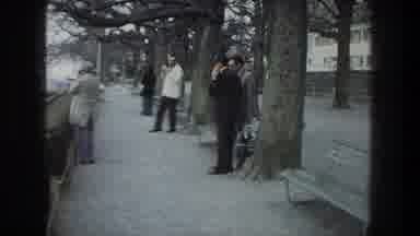 ZURICH SWITZERLAND-1976: Group Of Men Sightseeing And Taking Photographs