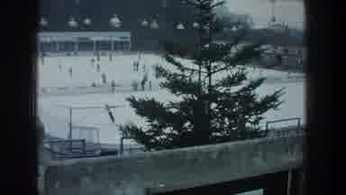 ZURICH SWITZERLAND-1976: Passing View Of Tree And Outdoor Skating Rink On A Winter Day