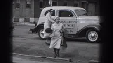 Reading Pennsylvania (1938): Two Nurses Holding Coats Get Off A White Car With