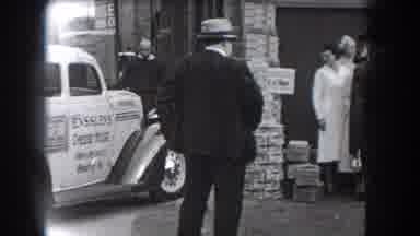 Reading Pennsylvania (1938): The Man Facing Away From The Camera Watches The Car