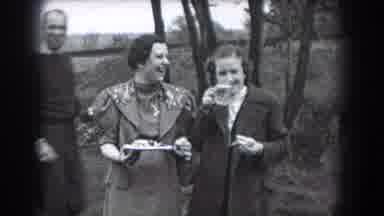 Reading Pennsylvania (1938): Woman Wearing Grey Coat Drinks Beverage From Glass