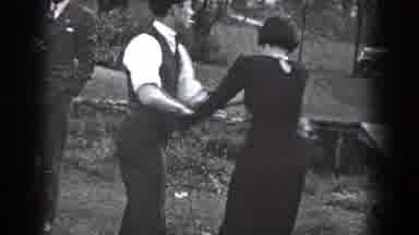 Reading Pennsylvania (1938): A Couple Is Struggling With Each Other Around Other