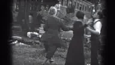 Reading Pennsylvania (1938): Crowd Walks Through Grassy Path Crossing Bridge Man