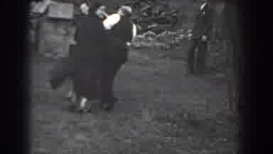 Reading Pennsylvania (1938): Woman Wearing Black Coat Waves Camera Away On A