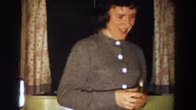 Aliquippa Pennsylvania (1958): A Young Woman Is Seen In A Room With A Small Child