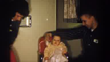 Aliquippa Pennsylvania (1958): Two Adult Playing With A Baby In A Chair Getting