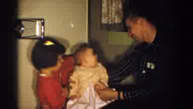 Aliquippa Pennsylvania (1958): An Older Man With A Baby On His Knee Is Joined By A